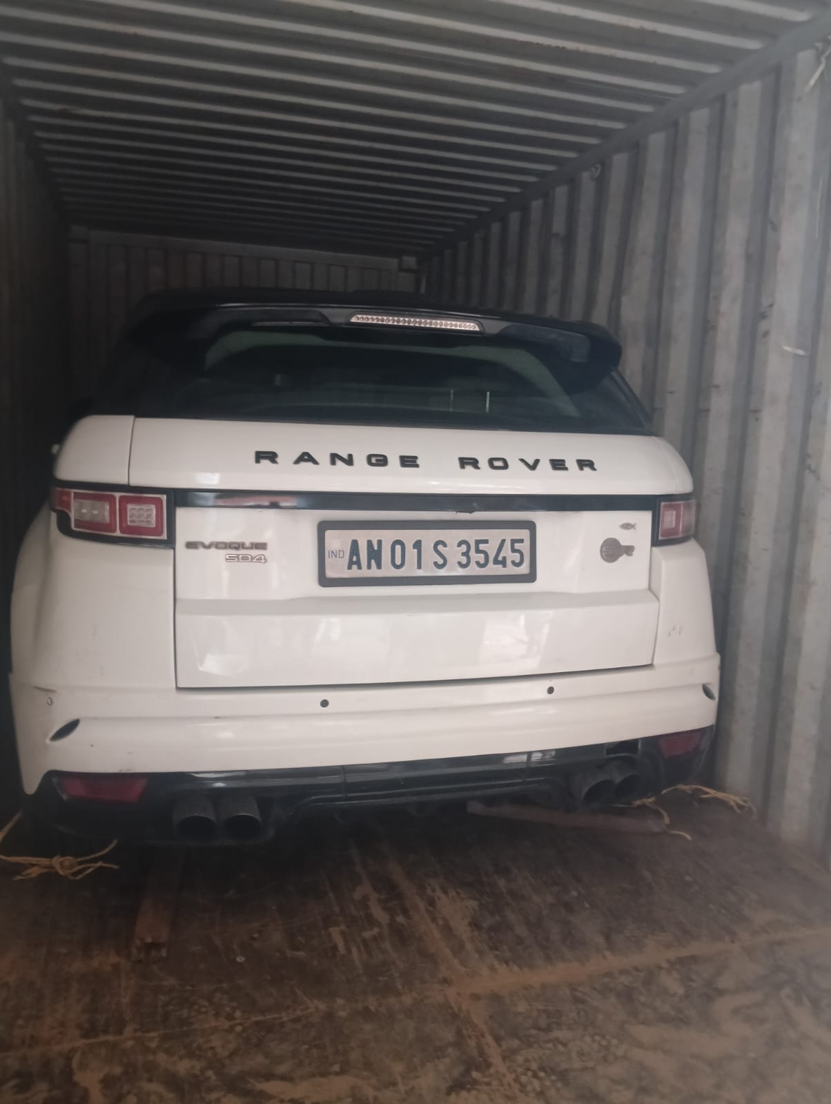Car loaded inside a shipping container