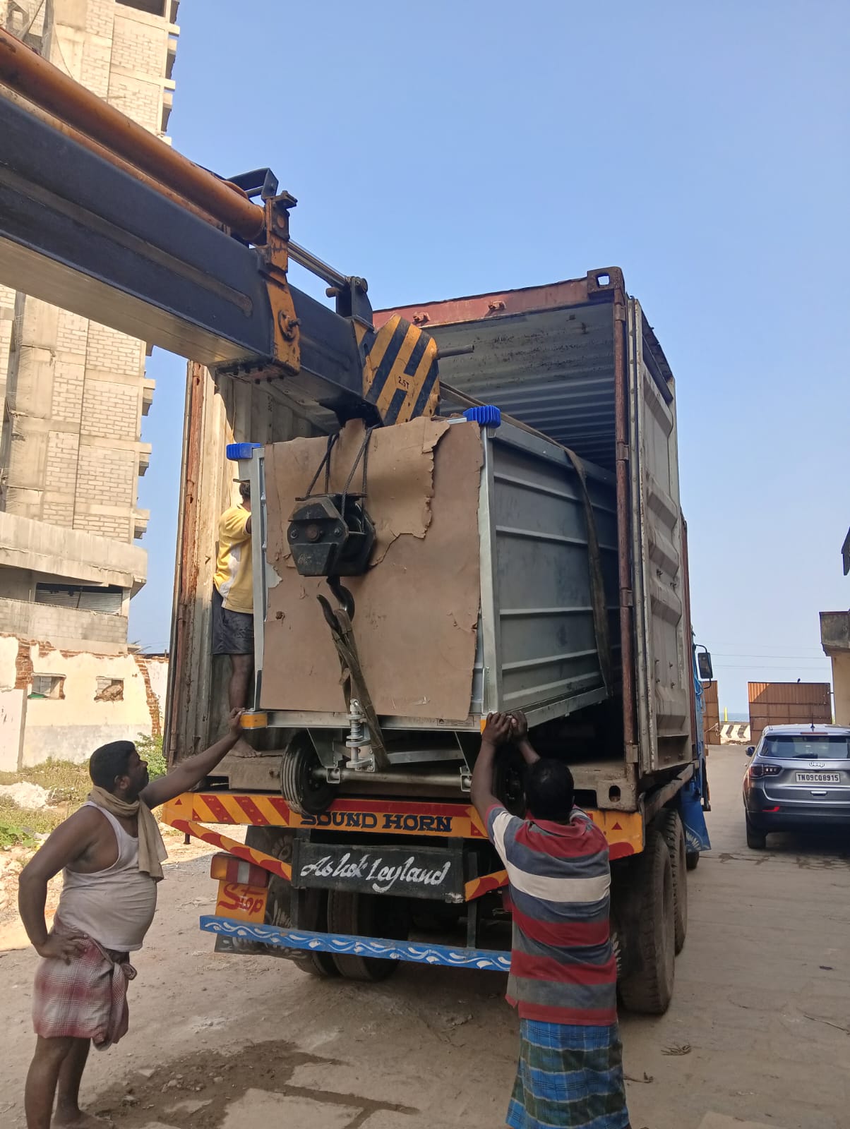 Heavy equipment being loaded for cargo transit