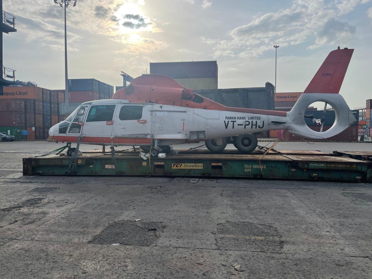 Helicopter loaded on a flat rack for transport